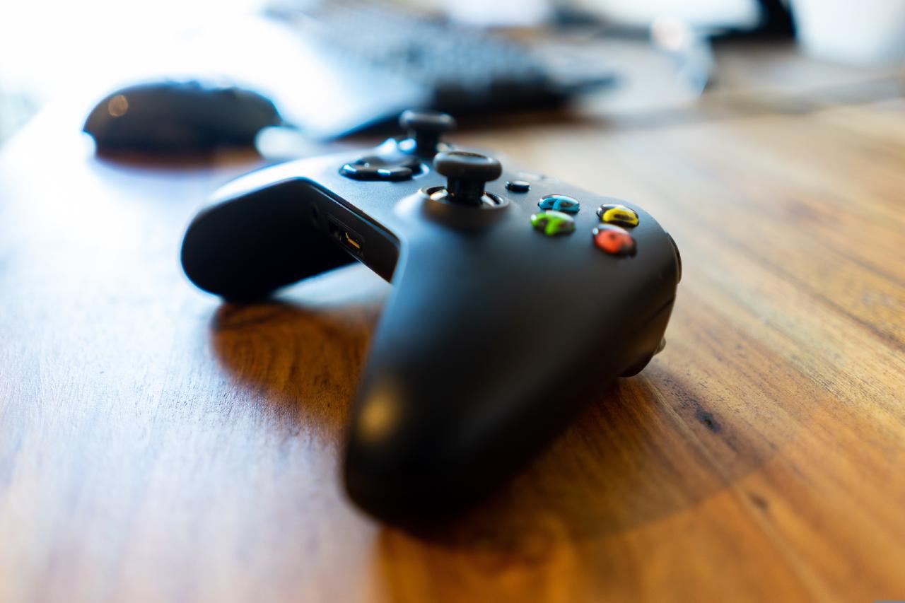Photo of a game controller, a keyboard, and a mouse